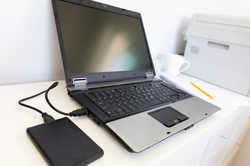 A modern laptop computer on an office desk