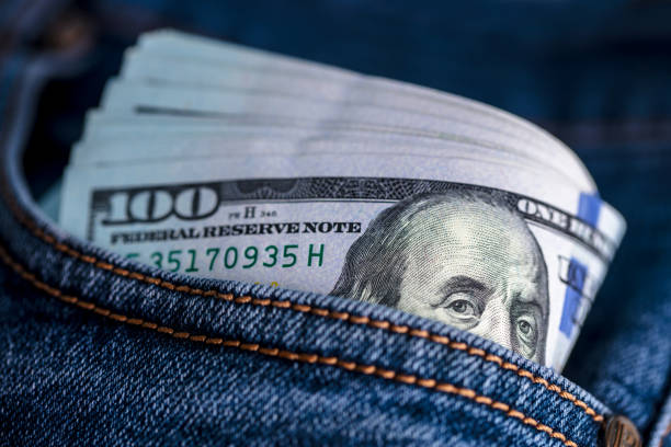 istock Dollar bills in jeans pocket 1436333274