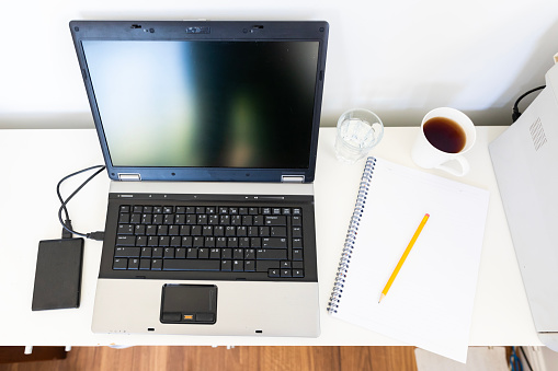 A modern laptop computer on an office desk