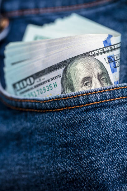 istock Dollar bills in jeans pocket 1436333310
