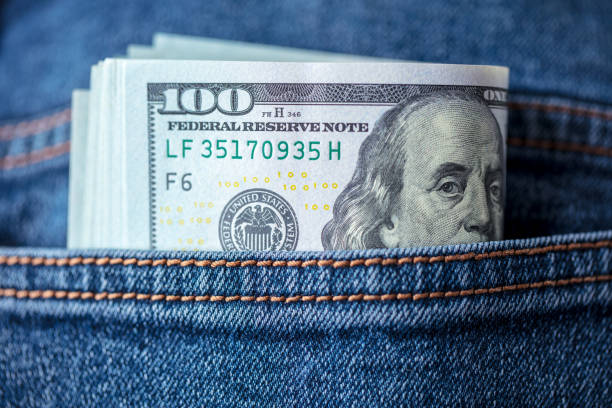 istock Dollar bills in jeans pocket 1436333430