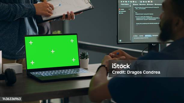 Database Admins Analyzing Source Code And Greenscreen Display On ...