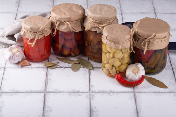istock Pickled vegetables in glass jars. 1436338943