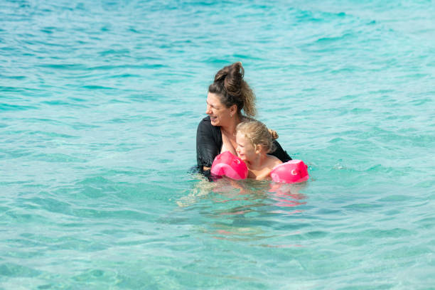 istock Mother teaches her daughter to swim. 1436340884
