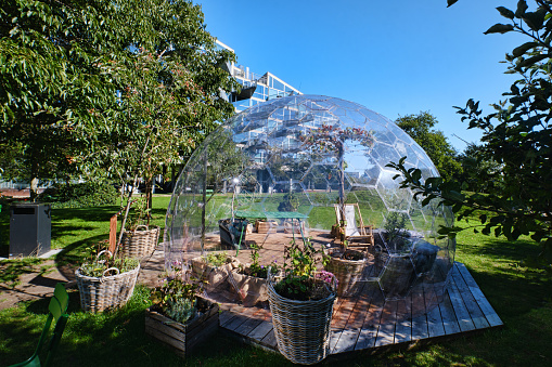 Copenhagen, Denmark - Sept 2022:  Transparent Garden Glass Geodesic Dome Tent greenhouse like igloo in Orestad District