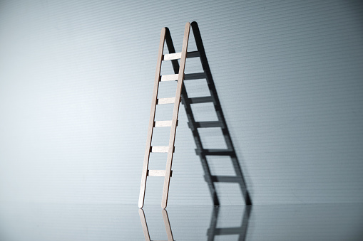 step ladder lean on the gray background