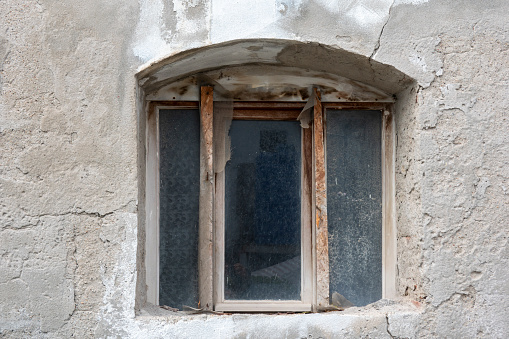 old window in abandoned home