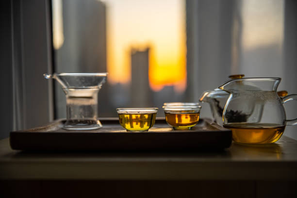 istock Glass teapot and cup on table 1436350217