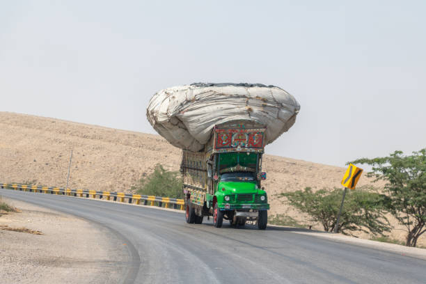 istock dangerously overloaded truck carrying cargo 1436351340