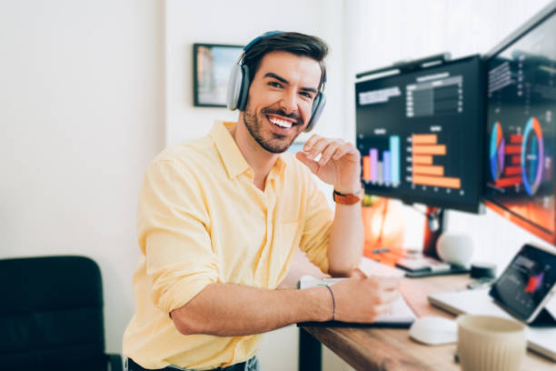 istock Man working at standing desk at home 1436351360