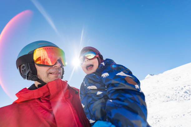 istock Father and little son skiing at the mountain 1436351982