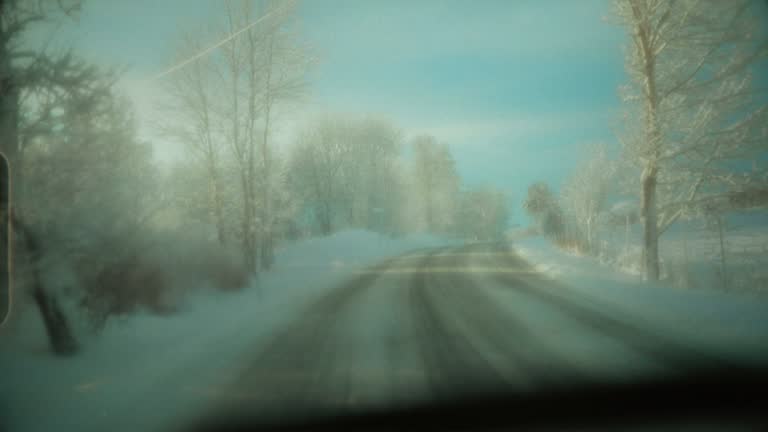 POV car driving in snow: mountain pass in Norway