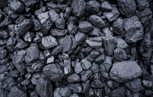 High angle view of coal texture, background with copy space