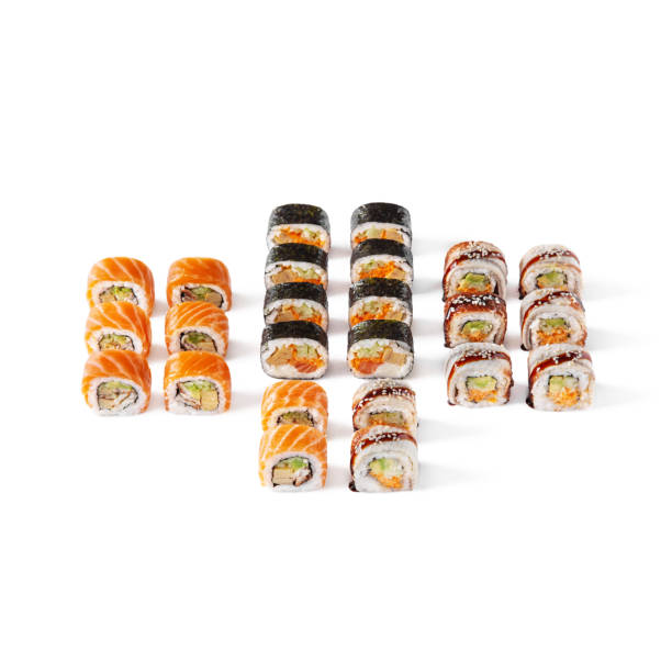 istock Assorted different rolls, with salmon, shrimps, sesame seeds, eel, avocado, tobiko caviar, cucumbers, omelet, on a white background 1436357754