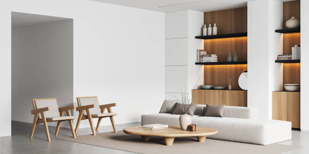 istock Corner view on bright living room interior with armchairs, sofa 1436357960