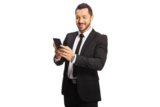 istock Smiling businessman typing on a phone 1436358192