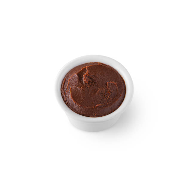 istock Orange sauce in a bowl on a white background 1436358285