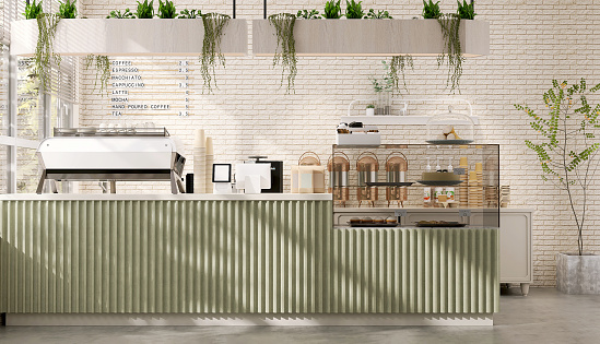 Modern and luxury design of cafe counter with espresso machine, digital tablet computer cash register and cake display refrigerator with sunlight and leaf shadow from window on white brick wall