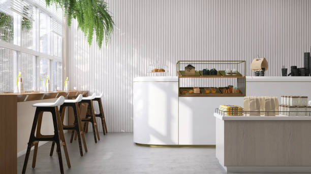 istock Modern and luxury cafe design with white counter, cake display refrigerator, bar height table and chair in sunlight from window 1436360940