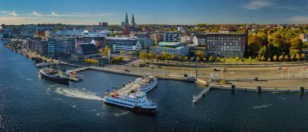 Panorama of Kiel city center and harbor with line ferry. Kiel Fjord Museum Harbour in the foreground, in the background the Kiel Castle. Kiel harbor inner fjord Schleswig Holstein, Germany.