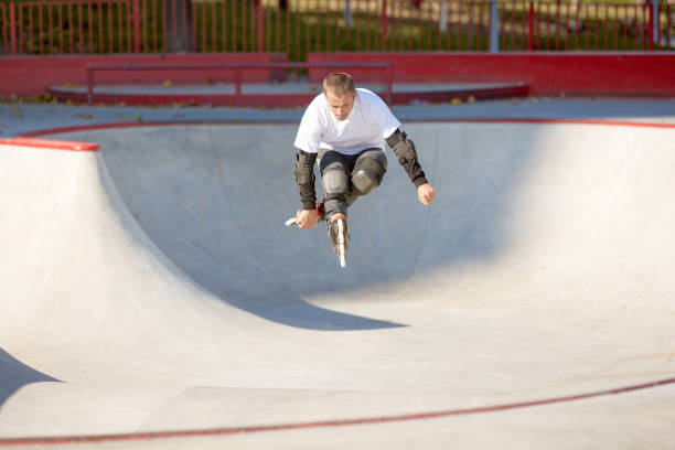 istock One man, male roller skater on rollerblades training at modern skate park, outdoors. Action, motion, skills and challenges. Doing different tricks 1436364282