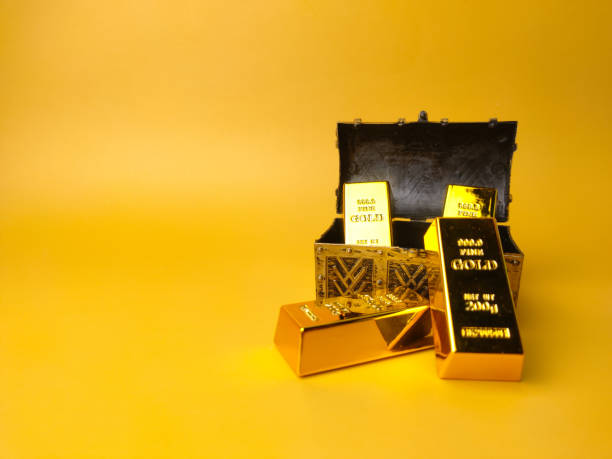 istock Treasure box with gold bar on a yellow background 1436365741