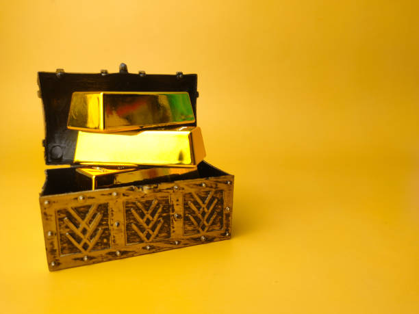 istock Treasure box with gold bar on a yellow background 1436365834