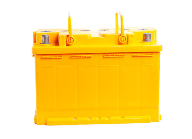 istock yellow car battery isolated on white background. 1436366662