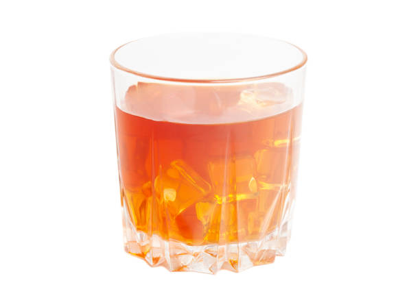 istock Glass of whisky and ice isolated white background 1436366806