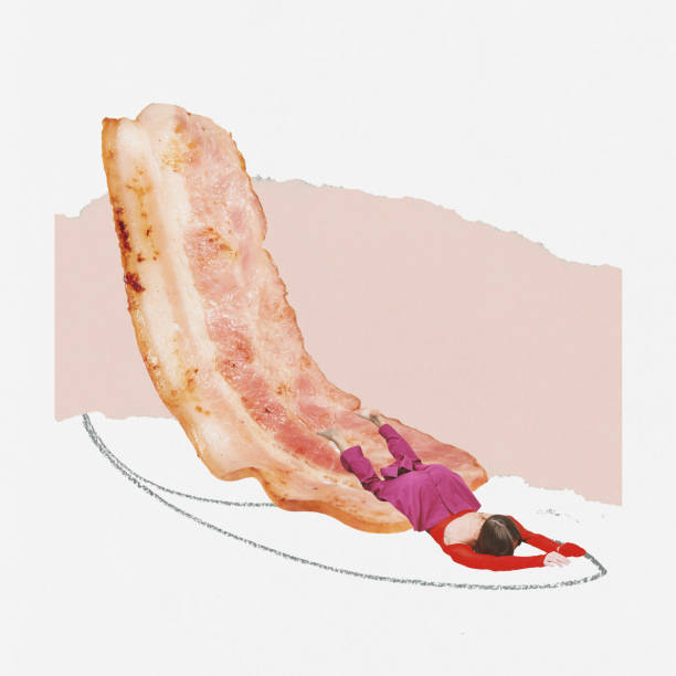 istock Contemporary art collage. Creative design with young girl sliding down fried bacon. Sleepy morning 1436367730