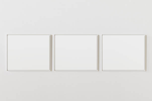 istock Group of three empty picture frames hanging on white wall at same height. Template for your content. 3D illustration. 1436367871