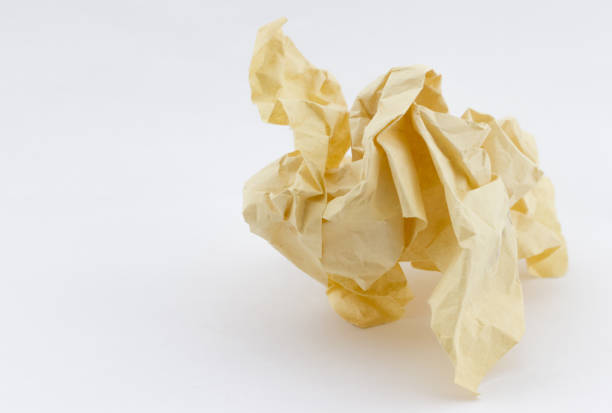 Old yellowed crumpled paper on white background with place for your text