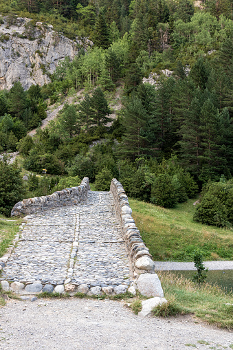 Bujaruelo ancient bridge in Pyrenees range, spain