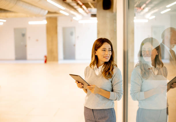 istock Young woman with digital tablet in the office 1436375889