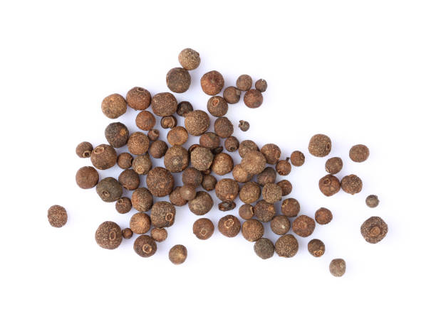 istock Black peppercorns isolated on white background 1436375916