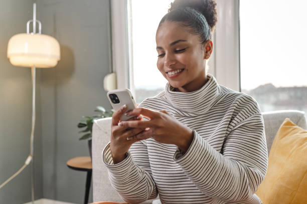 istock Young woman relaxing at home and using social media 1436376140