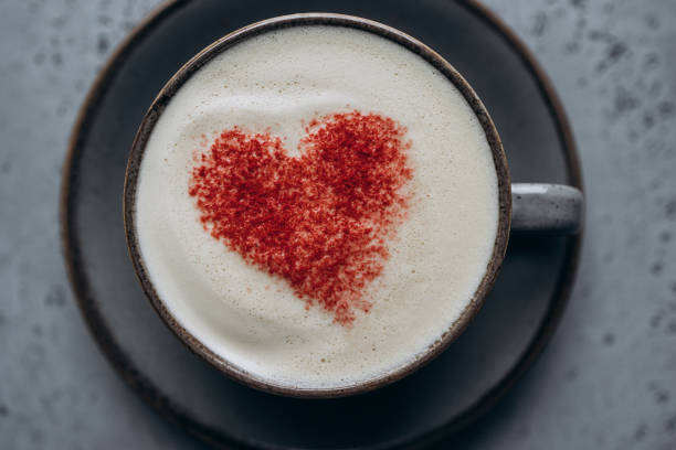 Coffee with a pattern in the shape of a heart on the foam