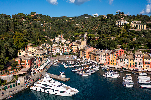 Portofino is a fishing village on the Italian Riviera coastline, southeast of Genoa city. Pastel-colored houses, high-end boutiques and seafood restaurants fringe its Piazzetta, a small cobbled square overlooking the harbor, which is lined with super-yachts. A path leads from the Piazzetta to Castello Brown, a 16th-century fortress and museum with art exhibitions and panoramic views of the town and the Ligurian Sea.