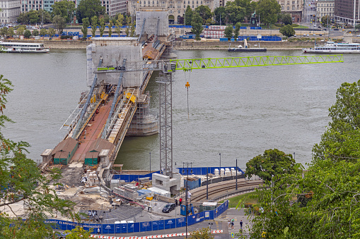 Budapest, Hungary - July 31, 2022: Renovation of Chain Bridge Szechenyi Over Danube River in Budapest at Summer Day.