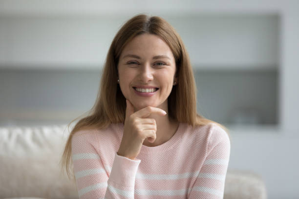 istock Head shot portrait beautiful woman looking at camera 1436376721