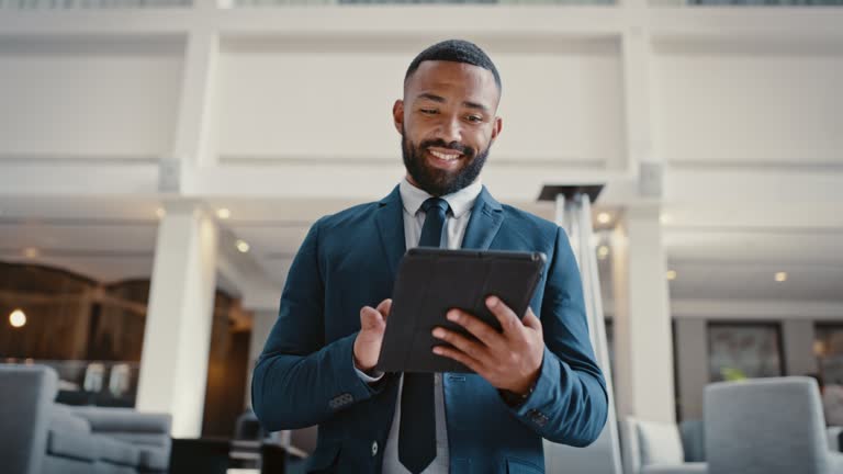 Businessman, tablet and smile for email, communication or social media on web. Black man, corporate and executive with tech for reading news, stock or market information with happy look in New York