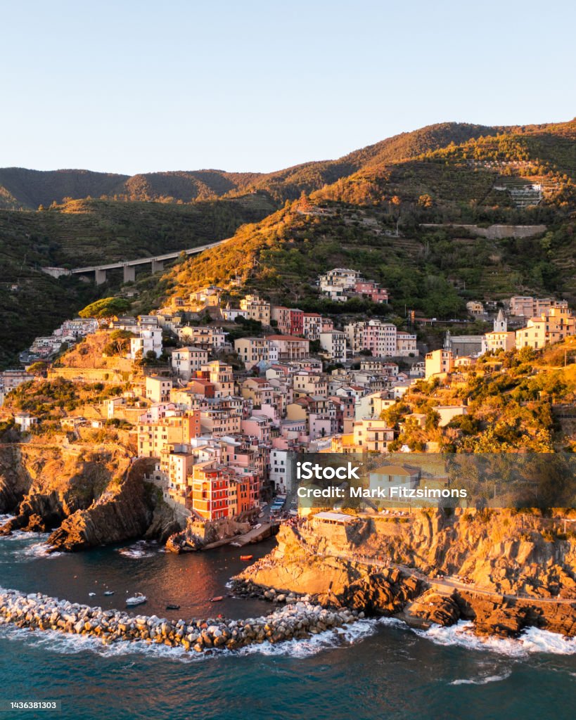 Riomaggiore, Cinque Terre, Italian Riviera, Italy Aerial shot of the picturesque town of Riomaggiore, filled with colourful houses and Italian Culture Architecture Stock Photo