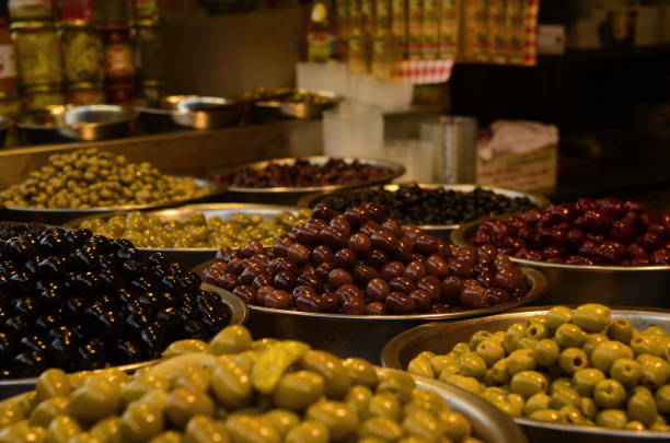 istock Marinated olives close-up. Market stall with olives 1436382882