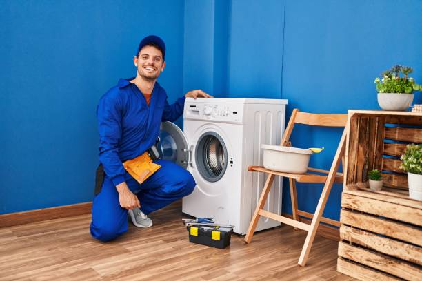 istock Young hispanic man working on washing machine looking positive and happy standing and smiling with a confident smile showing teeth 1436382903