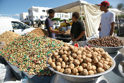 Market Stall at Djemma el Fna Square in Marrakesh, Morocco, where many tourist souvenirs are on display.