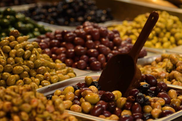istock Marinated olives close-up. Market stall with olives 1436383354