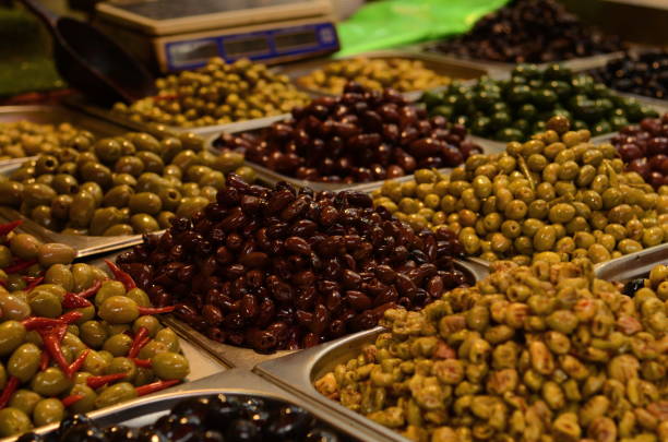 istock Marinated olives close-up. Market stall with olives 1436383355