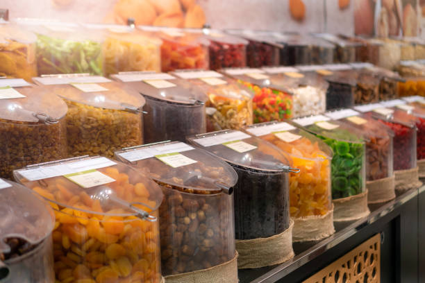 istock Assorted dried fruits in plastic containers in the store close-up 1436383454