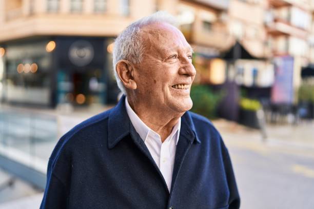 istock Senior man smiling confident standing at street 1436384234