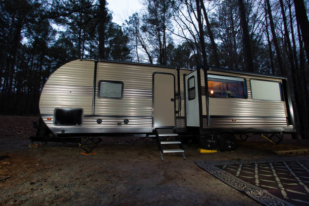 istock Camper in a forest as night falls 1436384660